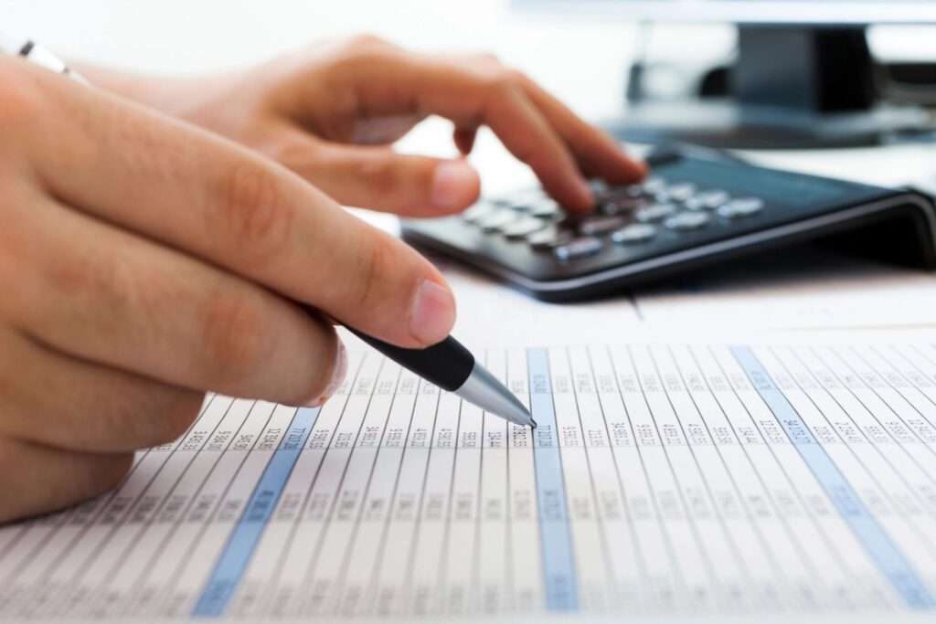 Investor reviewing bookkeeping software to track real estate finances