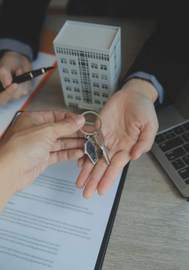 Real estate agent and customer signing contract to buy house, insurance or loan real estate.rent a house,get insurance or loan real estate or property.